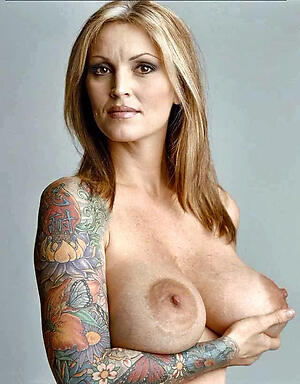 Uncover mature tattooed slut pics